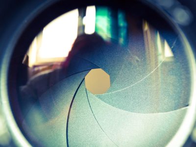 The diaphragm of a camera lens aperture.