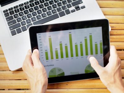 tablet with infographics on the screen